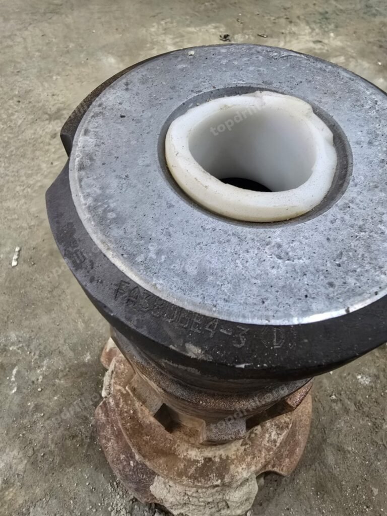 Broken plastic foot valve on a DTH hammer bit shank