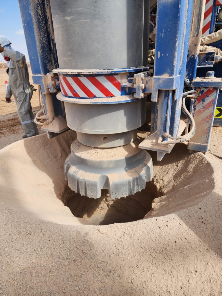 Topdrill TG640C DTH hammer with a Ø1,000 mm bit mounted on a truck-mounted drill rig