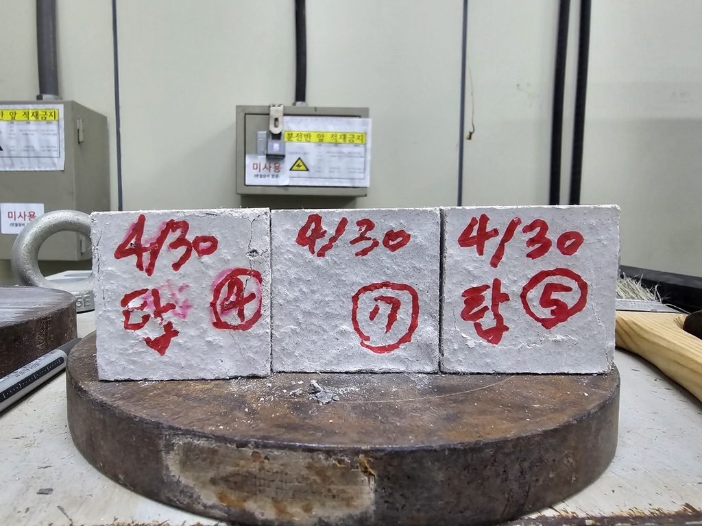 50 mm UHPC specimen in the compressive-strength testing machine
